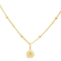 Stia Couture Mini A Love Letter Gold Necklace featuring an engraved A initial pendant on a dainty gold-plated beaded chain.