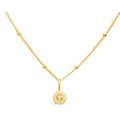 Stia Couture Mini G Love Letter Gold Necklace featuring an engraved G initial pendant in 14K gold plated sterling silver on a delicate Saturn chain.