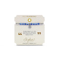 A bracelet with vibrant blue stones and a delicate silver charm, showcasing a blend of elegance and charm.