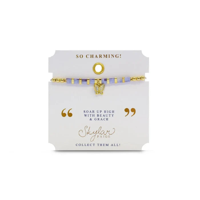 A stylish gold bracelet adorned with a tiny diamond charm, perfect for adding a touch of elegance to any outfit.