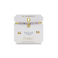 A stylish gold bracelet adorned with a tiny diamond charm, perfect for adding a touch of elegance to any outfit.