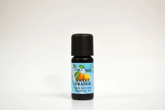 Bottle of sweet orange essential oil on a white background