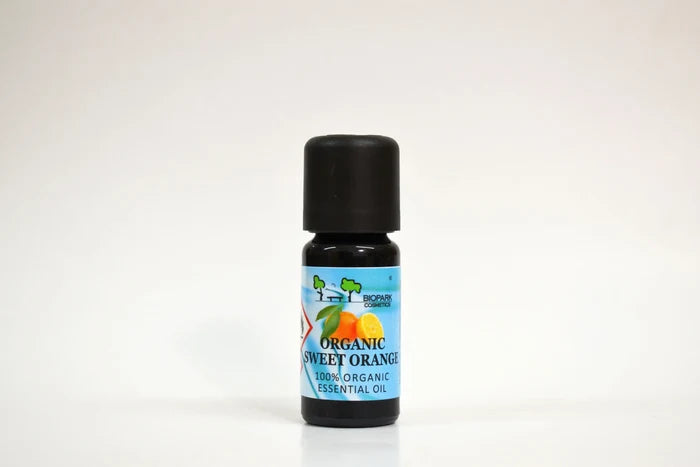 Bottle of organic sweet orange essential oil on a white background