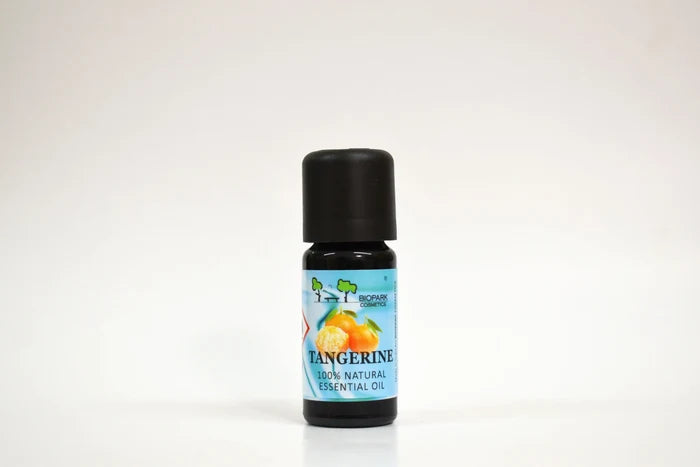 Bottle of tangerine essential oil on a white background