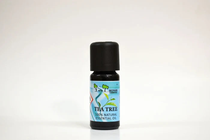 Tea tree essential oil bottle with a blue label on a white background