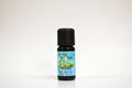 Bottle of thyme essential oil on a white background