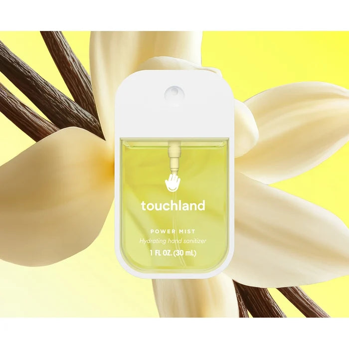Vanilla Blossom scent ingredients — vanilla beans, coconut, and citrus slices.