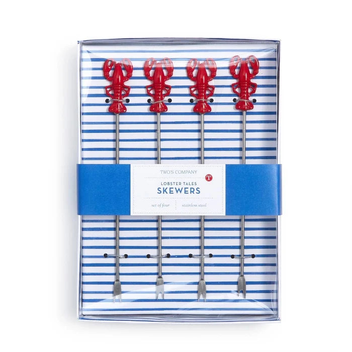 Lobster skewers arranged neatly in a takeout box, showcasing their vibrant color and appetizing presentation.