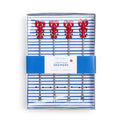 Lobster skewers arranged neatly in a takeout box, showcasing their vibrant color and appetizing presentation.