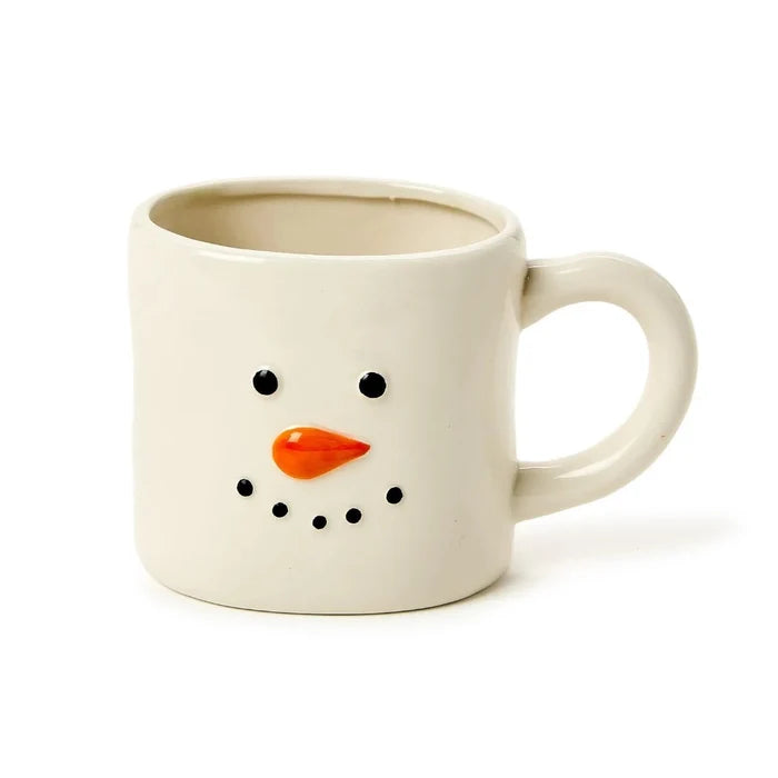White mug with a snowman face design on a white background