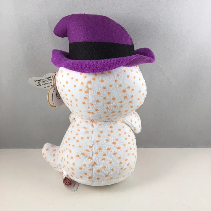 Plush toy with a purple hat on a gray background