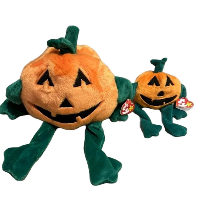 Two plush pumpkins with green leaves on a gray background