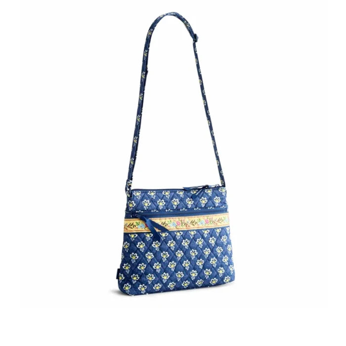 Soft fabric crossbody bag with a blue floral print, ideal for adding a touch of style to any outfit.