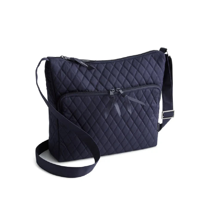 Navy blue quilted crossbody bag with a stylish design and adjustable strap.