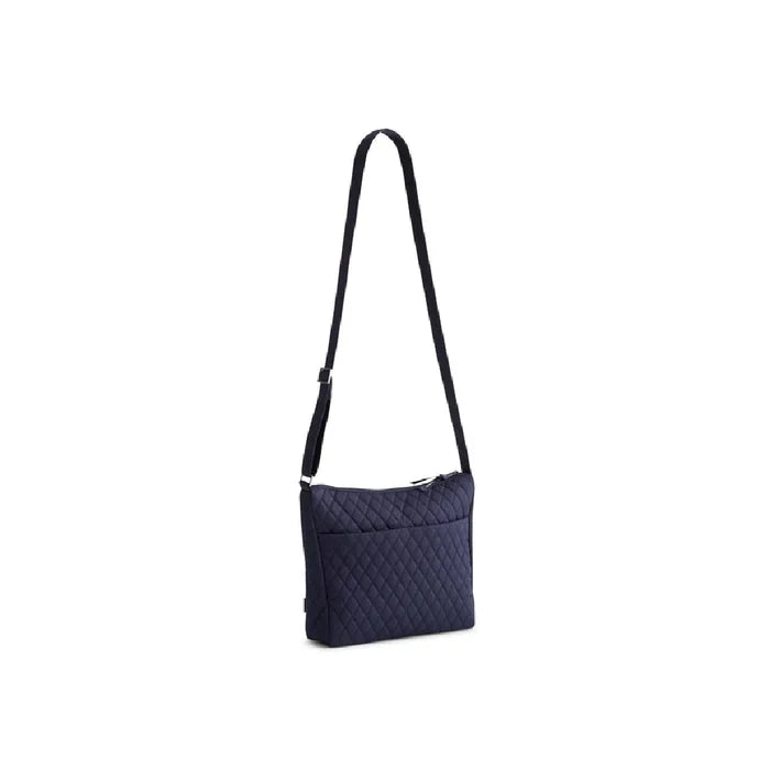 Navy blue quilted bag featuring a zipper closure.
