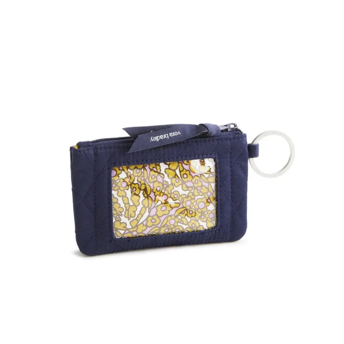 A small purse with an attached key chain, designed for convenience and easy access to essentials.
