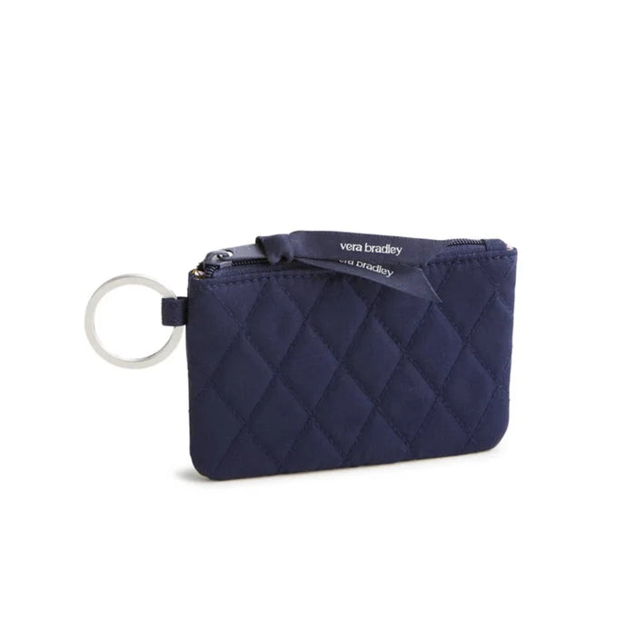 A small purse with a key chain attached, showcasing a compact design suitable for carrying essentials.