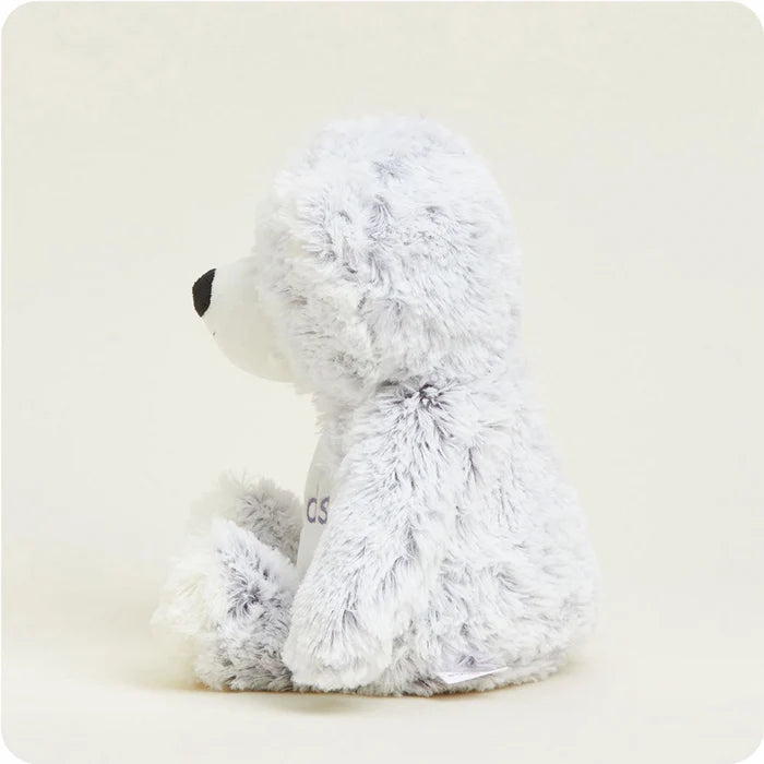 Side view of Warmies Friends Bear Plush highlighting plush texture, rounded shape, and soft stuffed arms and legs