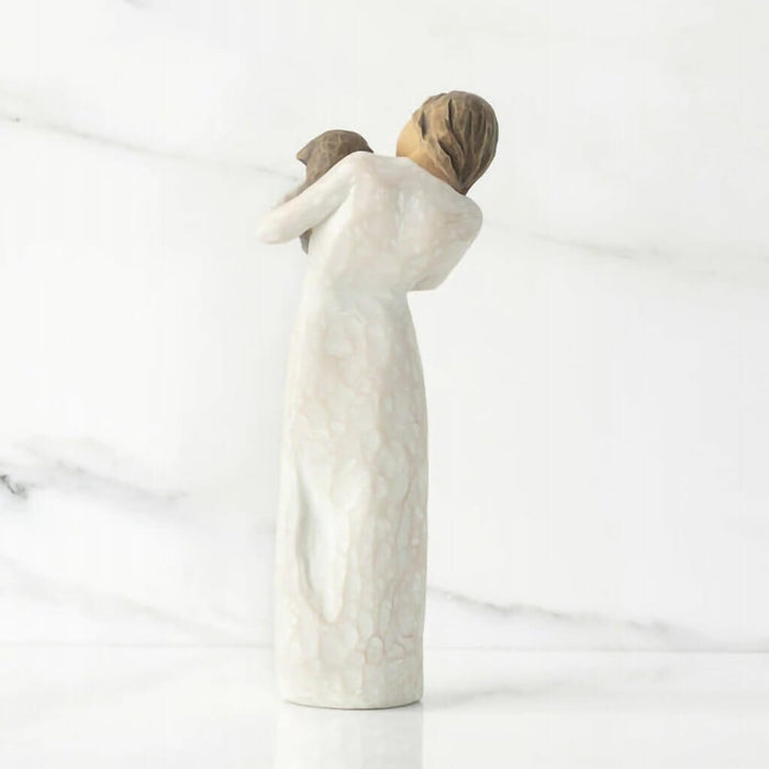 "Willow Tree Adorable You Figurine – Woman holding dark-colored dog, hand-painted resin sculpture expressing love and companionship"