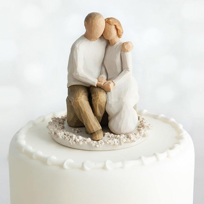 "Willow Tree Anniversary Cake Topper figurine featuring a seated couple in loving embrace, ideal for milestone wedding celebrations and vow renewals"
