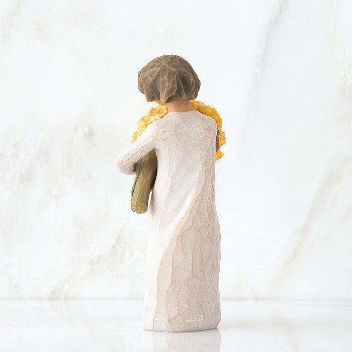 "Willow Tree Good Cheer Figurine – woman holding bouquet of yellow roses, hand-carved resin sculpture by Susan Lordi symbolizing happiness and encouragement"