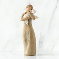 "Willow Tree Peace on Earth figurine of a woman holding a lamb, symbolizing peace and love"