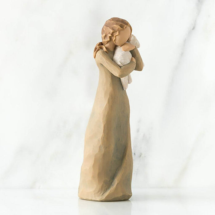 "Willow Tree Peace on Earth figurine of a woman holding a lamb, symbolizing peace and love"