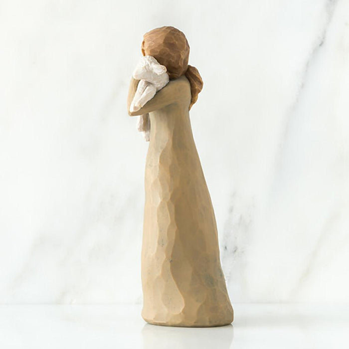 "Willow Tree Peace on Earth figurine of a woman holding a lamb, symbolizing peace and love"