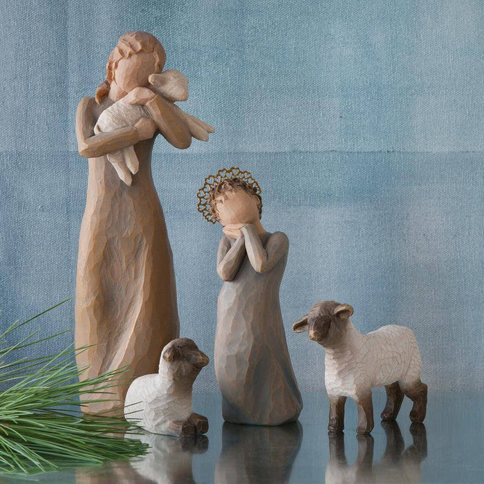 "Willow Tree Peace on Earth figurine of a woman holding a lamb, symbolizing peace and love"