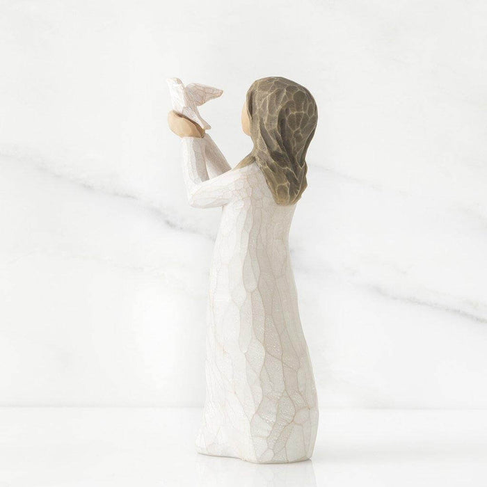 "Willow Tree Soar Figurine – Hand-painted resin sculpture of woman releasing bird, symbolizing encouragement, growth, and new beginnings"