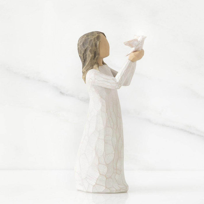 "Willow Tree Soar Figurine – Hand-painted resin sculpture of woman releasing bird, symbolizing encouragement, growth, and new beginnings"