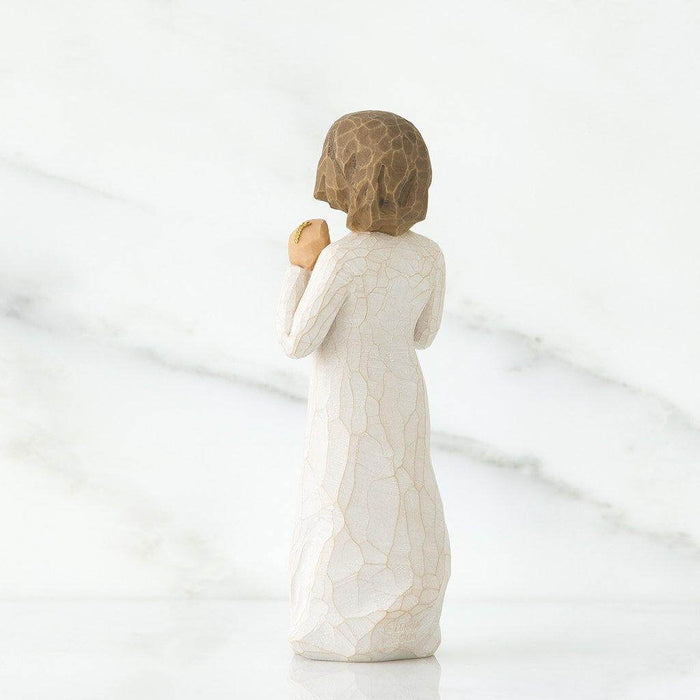 "Willow Tree Truly Golden figurine of a girl in white dress holding a gold necklace, symbolizing friendship and appreciation."