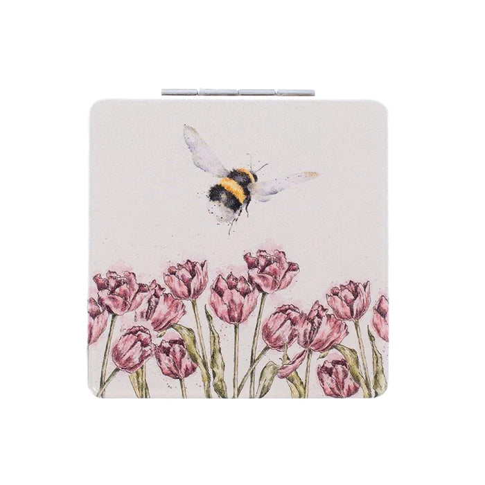 Wrendale Designs Flight of the Bumblebee compact mirror with bumblebee flying above pink tulips, illustrated by Hannah Dale.