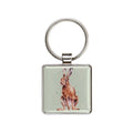 A square keychain featuring a cute rabbit design in the center.