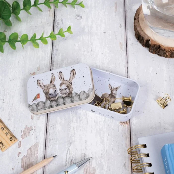 A decorative tin box adorned with a picture of a deer alongside a rabbit.