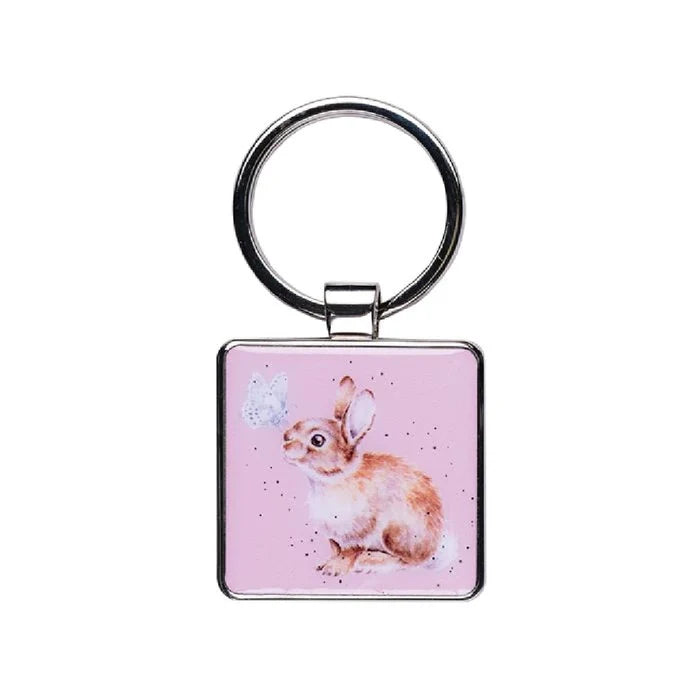 A pink keychain featuring a cute rabbit design, adding a playful touch to your keys.