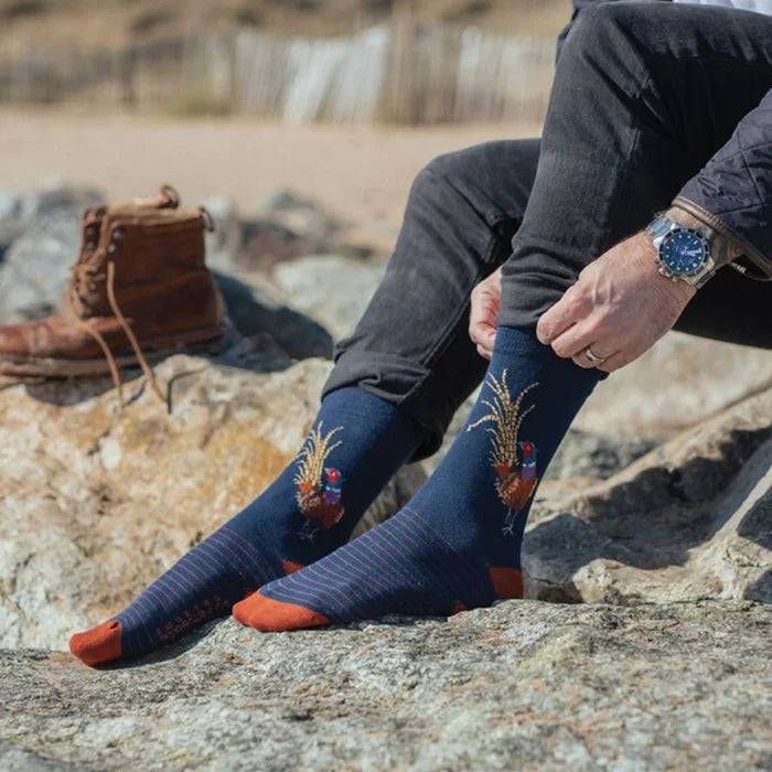 Socks adorned with a vibrant pheasant illustration, showcasing intricate details.