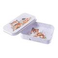 A small tin box featuring a whimsical fox design on its surface.