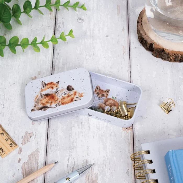 A decorative tin box adorned with a charming fox illustration.