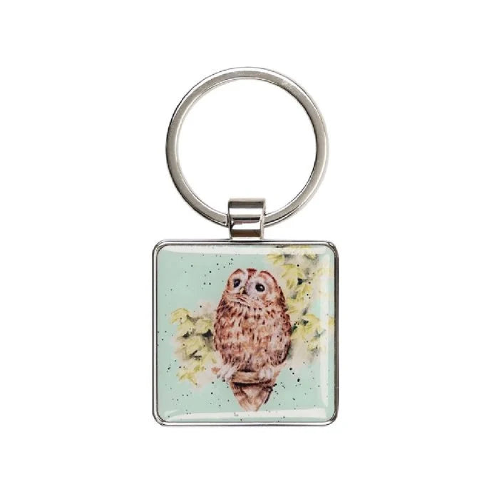 A square keychain adorned with a colorful owl design, showcasing its big eyes and feathers.