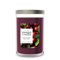 Yankee Candle Cranberry Chutney candle with cranberries and leaves on a white background